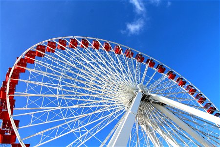 Red & White Ferris Wheel on Blue Sky photo