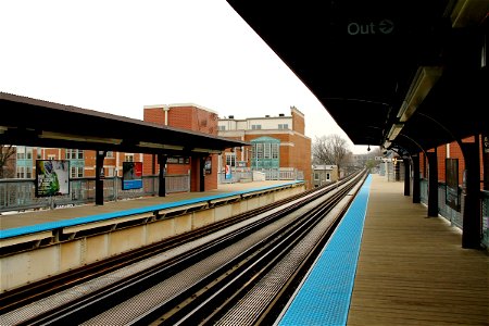 Train Tracks of Empty Train Station on Overcast Day photo