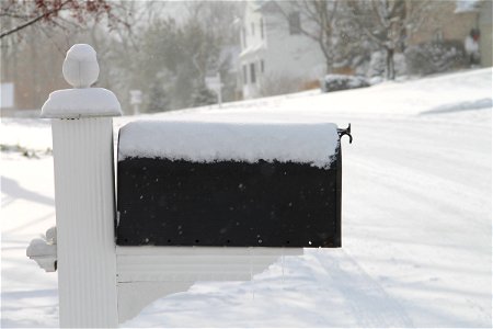 Snow Covered Mailbox in Neighborhood photo