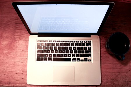 Macbook Laptop Top View with Coffee Mug photo