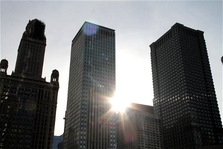 Sun Shining Through 3 Skyscraper Buildings photo
