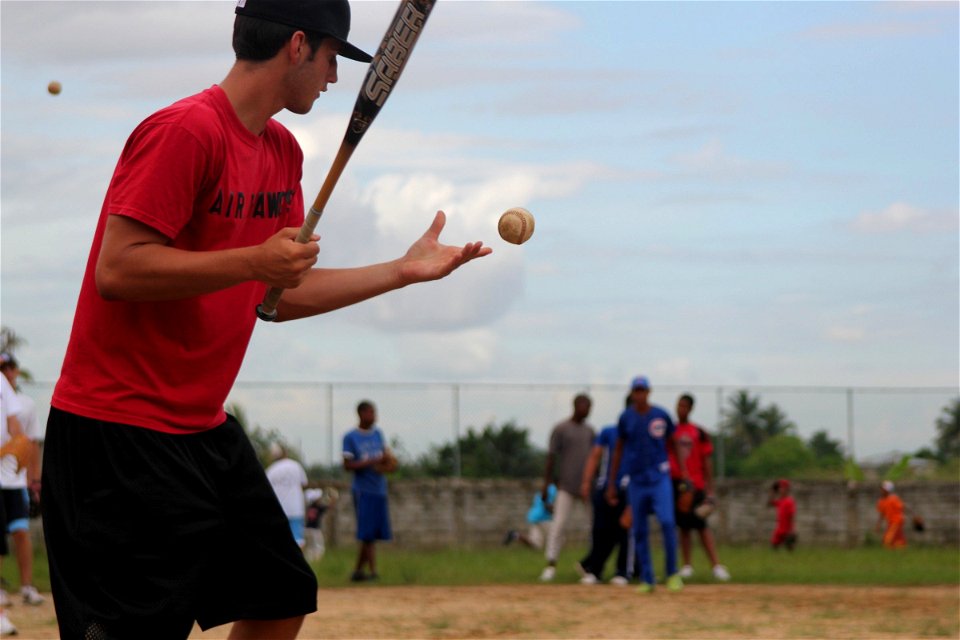 Man Hitting Baseballs for Practice Drills photo