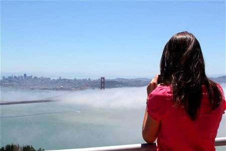 Woman Gazing at Golden Gate Bridge in Fog