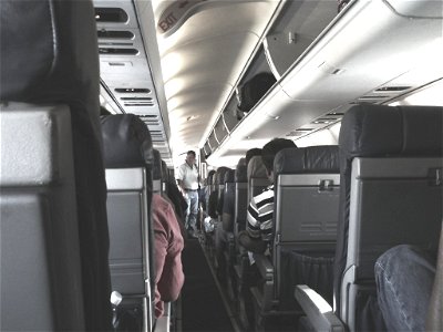 Airplane Aisle During Boarding photo