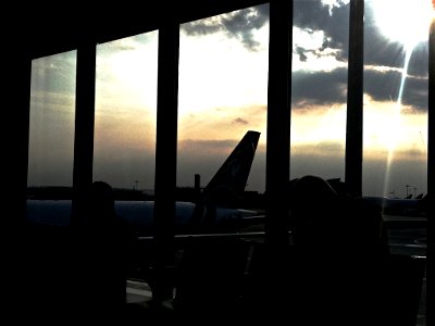 Silhouette of Plane Tail at Airport photo