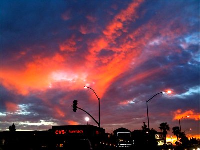 Silhouette of Street Lamps on Sunset Sky photo