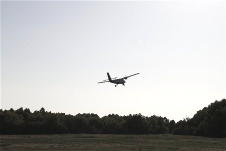 Small Airplane Taking Off Into Distance photo