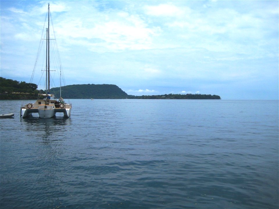 Single Yacht on Still Ocean photo
