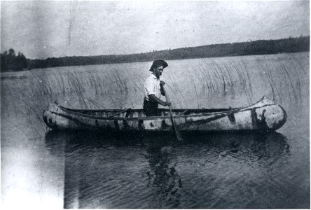 Native American in birch bark canoe, Basswood River, 1910-1912 photo