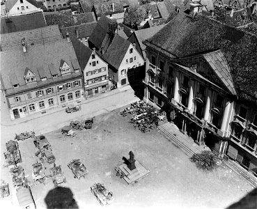 SC 335334 - Seventh Army Cavalry vehicles await orders to move on in the drive into Southern Germany in front of the city of Lauingen's Rathaus, or City Hall. photo