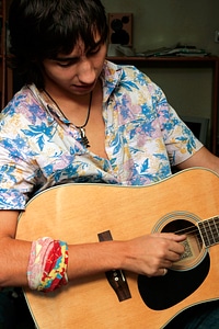 Boy playing guitar photo