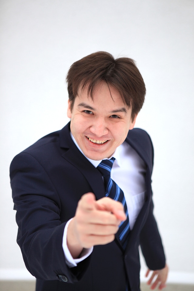 Business man points at you