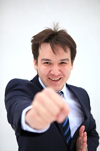 Young business man fighting with you photo