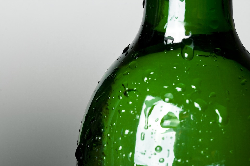 Green bottle with drops