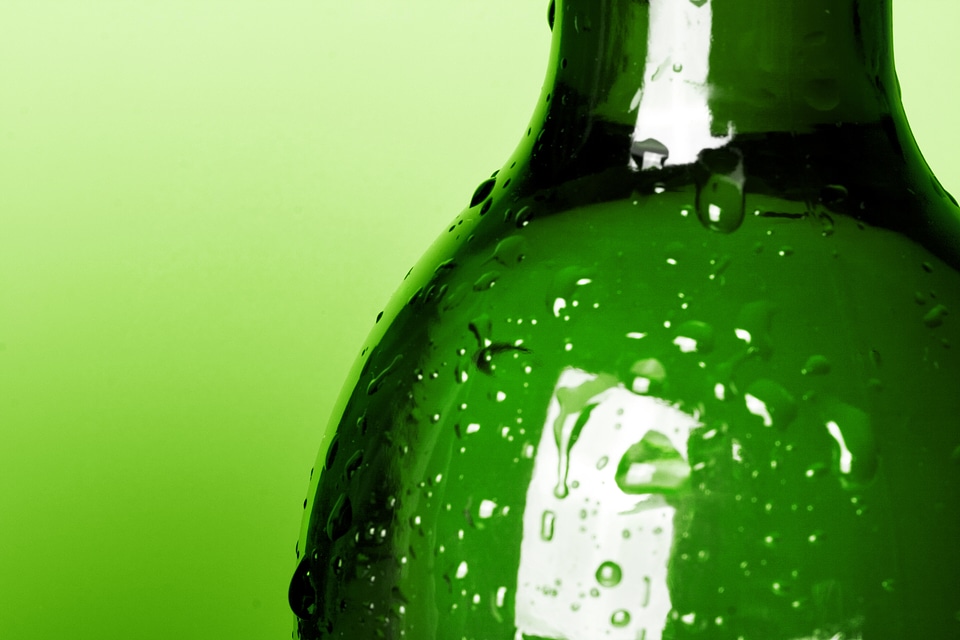 Bottle with water drops - Green Background