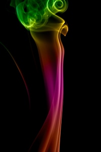 Rainbow colored smoke on black