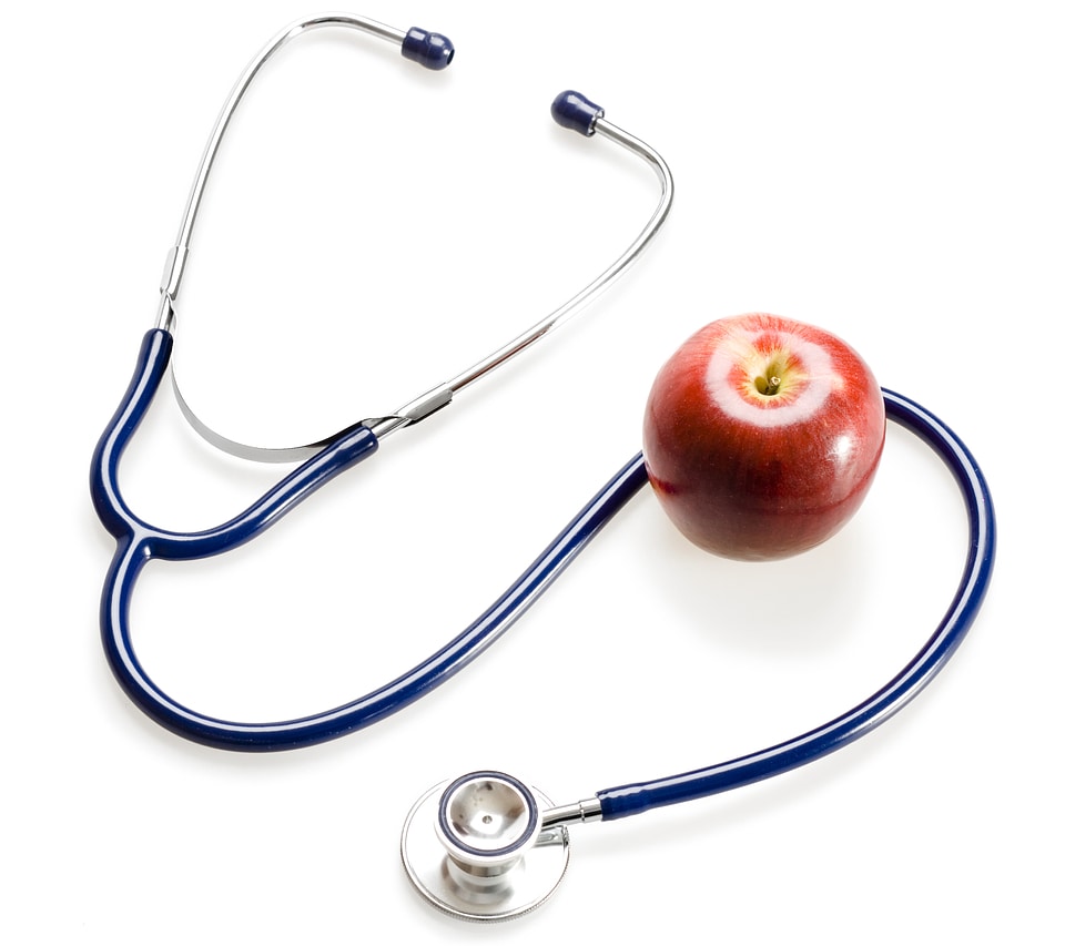 Medical Stethoscope and Red Apple photo