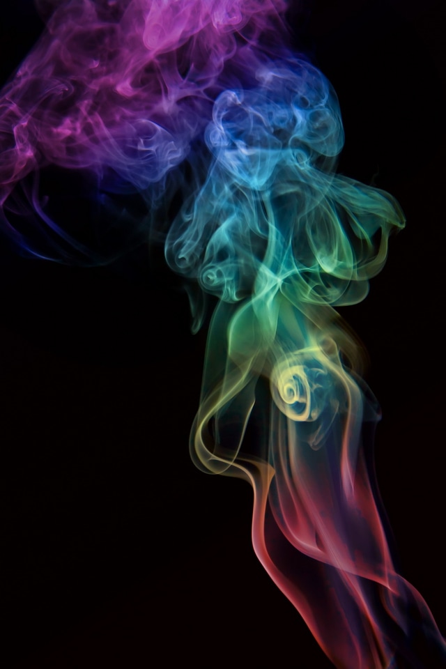 Rainbow smoke on black background