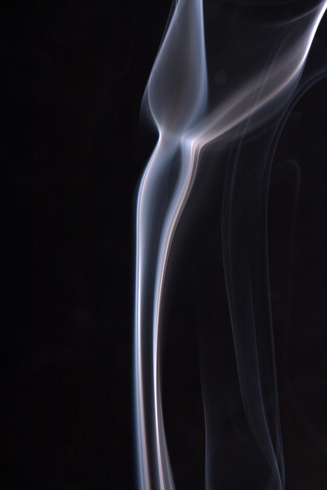 Blue smoke on black