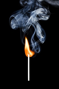 Match with flame and smoke