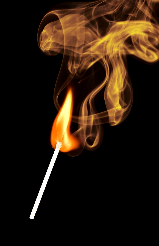 Lid match with yellow smoke