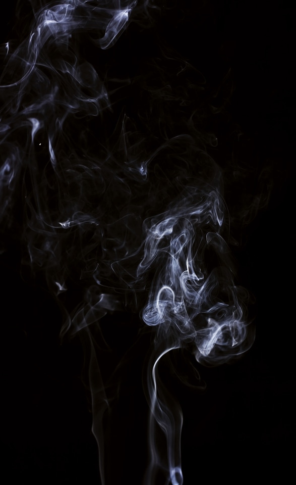 White smoke on black background