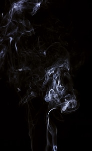 White smoke on black background