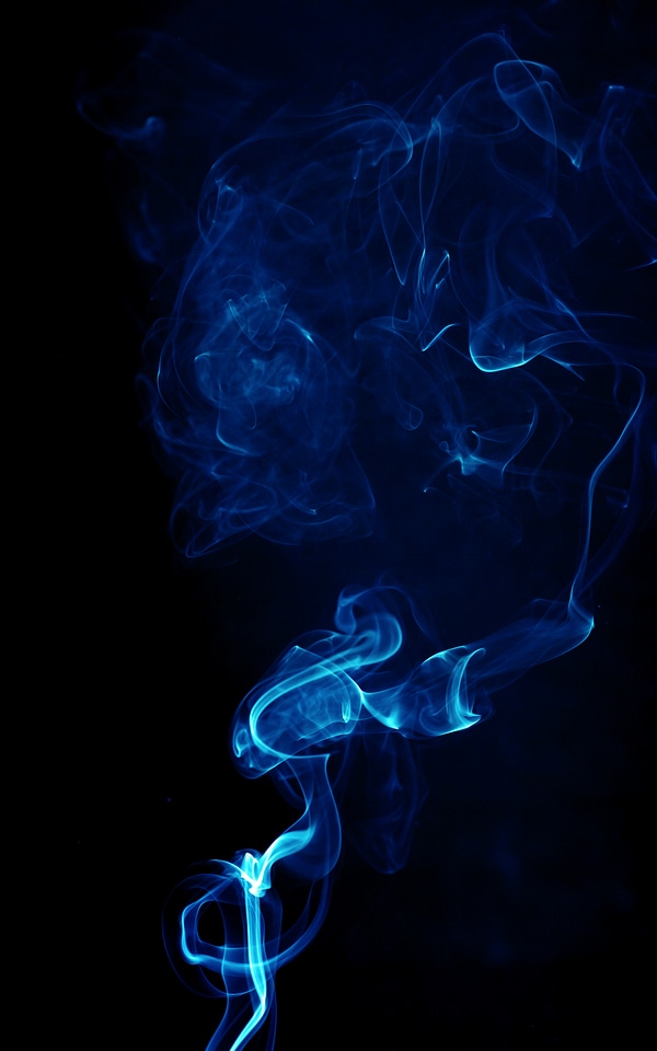 Dark blue smoke on black