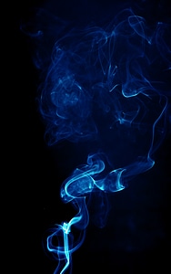 Dark blue smoke on black
