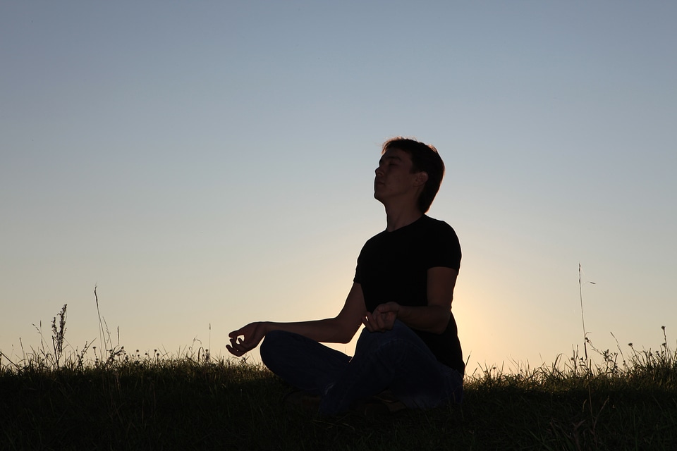 man in lotus pose photo