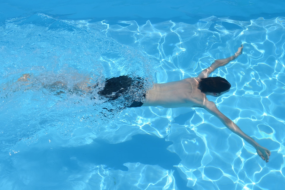 People swimming swimming pool