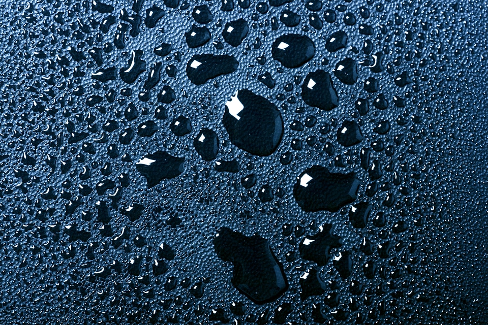 Water drops on dark blue background