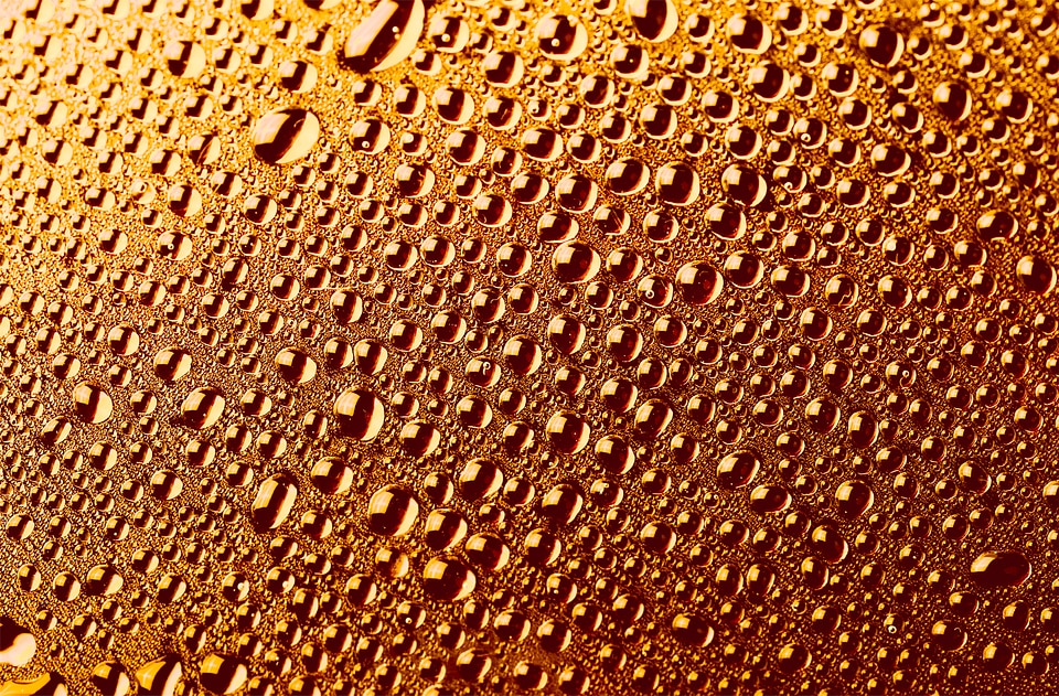 Water drops golden background