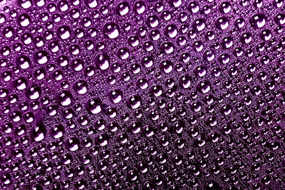 Violet water drops background