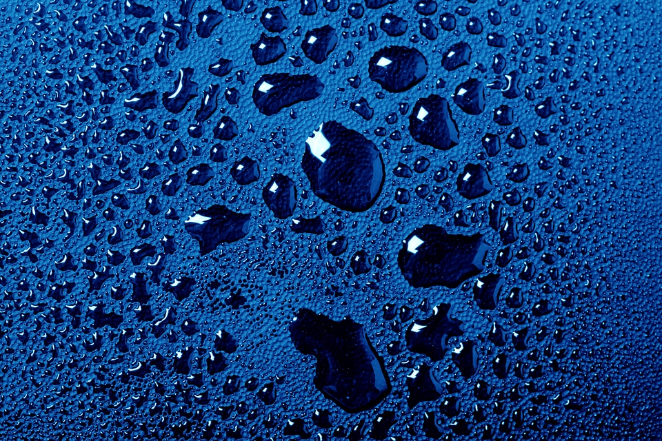 Blue water drops macro background
