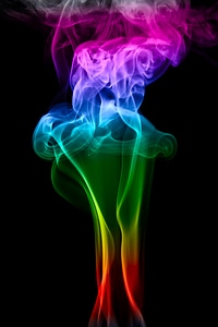 Colored smoke on black background