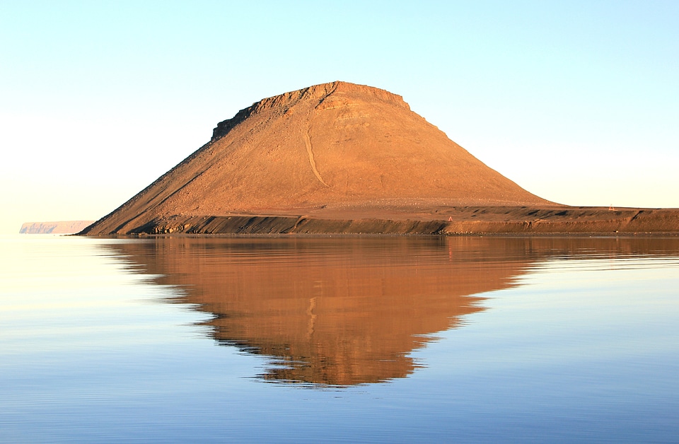 Cliff mirroring evening sun