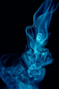 Swirls of blue smoke photo
