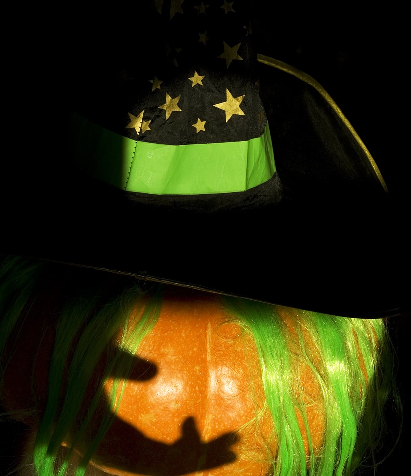 Halloween pumpkin with green hair and hat