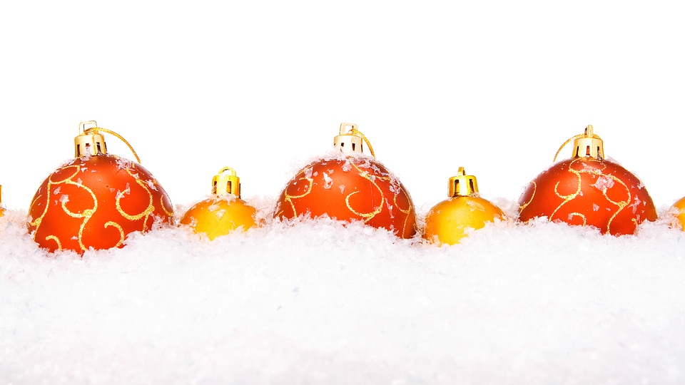 Red and Golden Christmas Balls in Snow