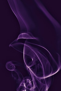 Violet smoke on black photo