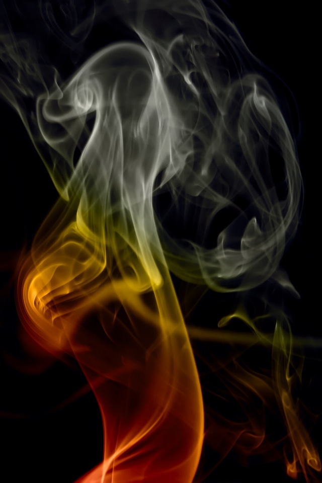 Red and gray smoke on black