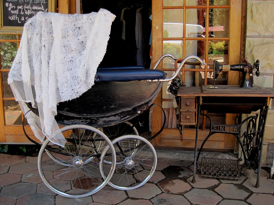Old sewing machine white lace covering grey floor paving