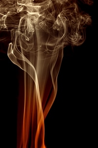 Swirling smoke on black photo