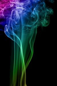 Multicolor smoke on black photo