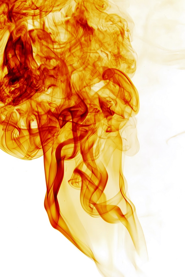 Orange smoke on white background