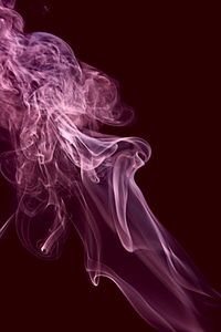 Purple abstract smoke on black photo
