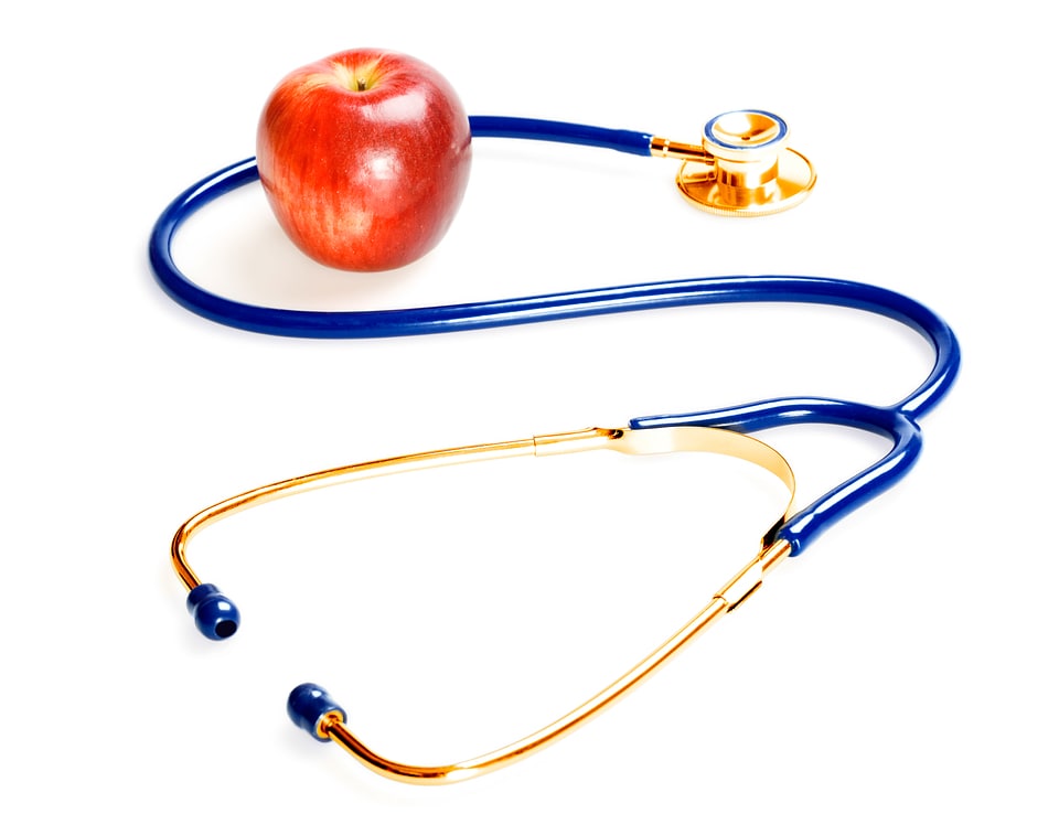 Golden Stethoscope and Red Apple photo