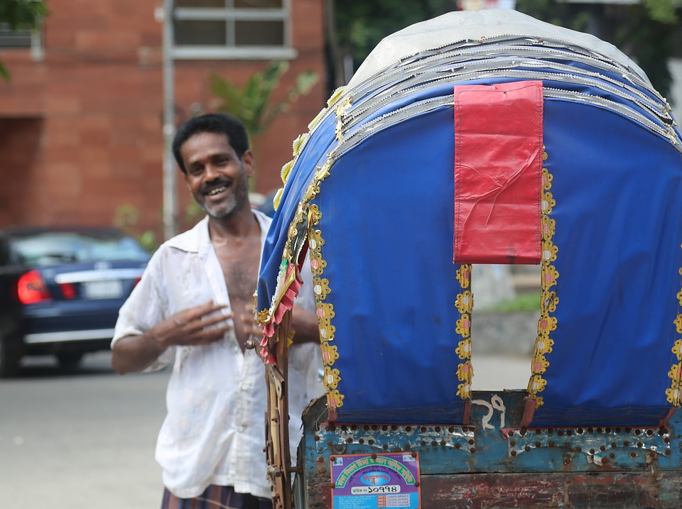 Smiling Rickshaw Driver