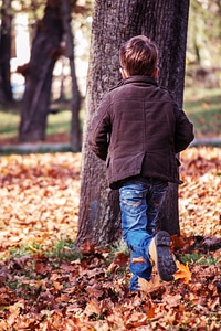 Toddler Running in the Park in Fall